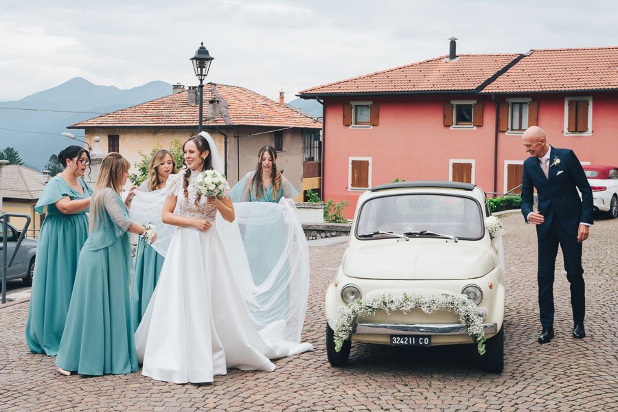 The Bridesmaids Help To Fix The Bride's Dress