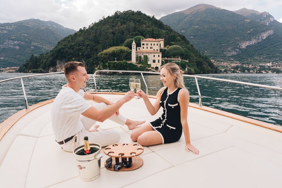 Two Young American Fiancés Toast After The Proposal in front of villa del balbianello