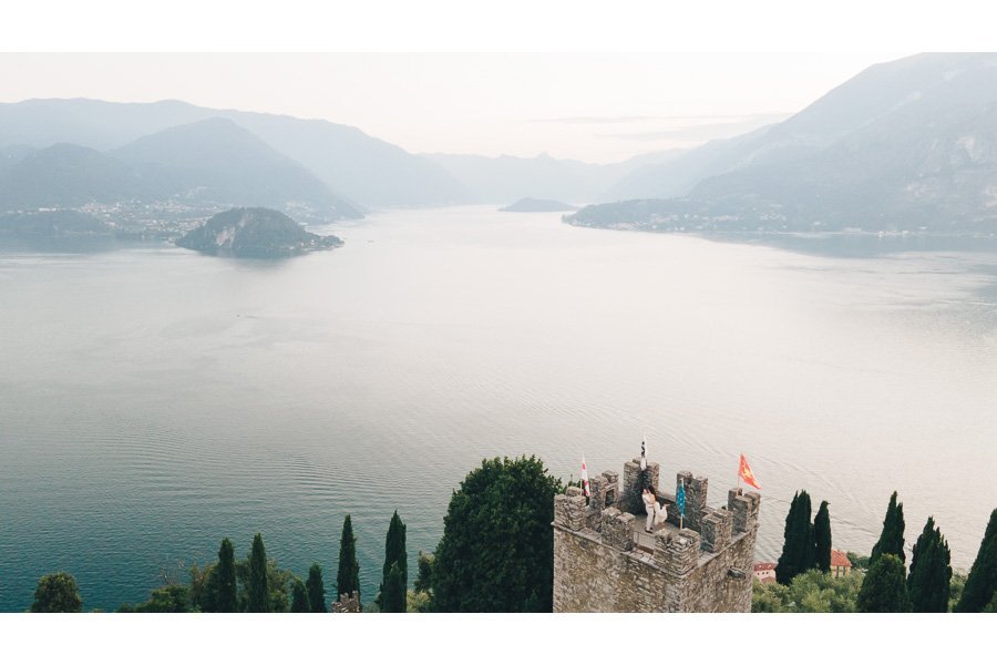 Two Young People Celebrate Their Engagement By Hugging Each Other On The Top Of The Tower Of Castello Di Vezio