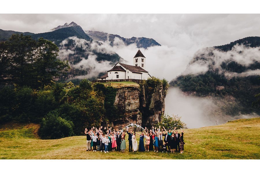 Wedding Group Photo In A Stunning Location Like Lord Of The Ring in calonico faido switzerland