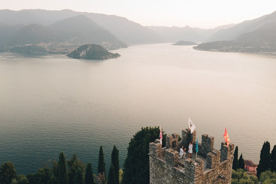 Wedding Proposal On The Top Of The Tower Of Castello Di Vezio during sunset in lake como